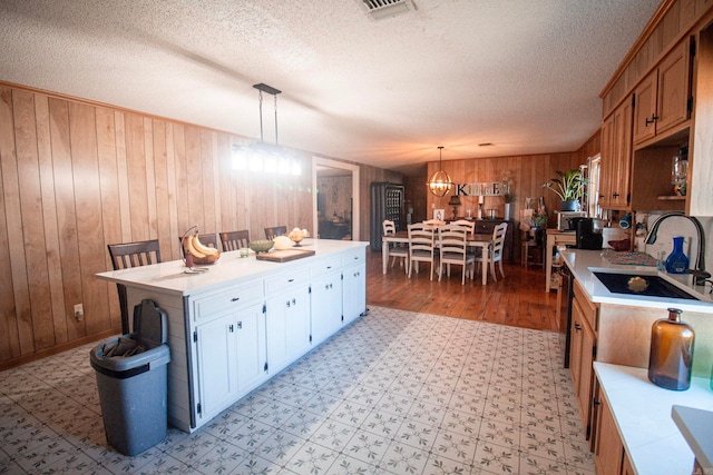 kitchen with light countertops, a sink, and visible vents