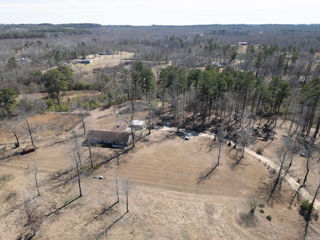 birds eye view of property with a rural view and a view of trees