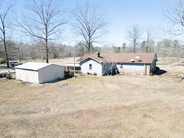 exterior space featuring an outbuilding and an outdoor structure