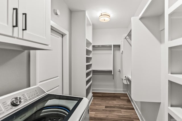 walk in closet featuring washer / dryer and dark wood-type flooring