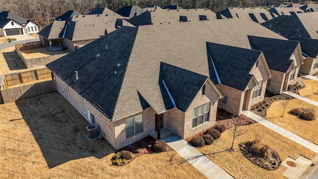 birds eye view of property with a residential view