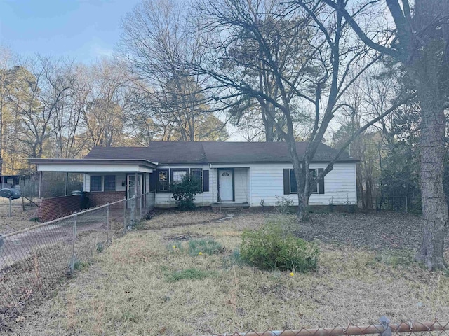 ranch-style home with fence