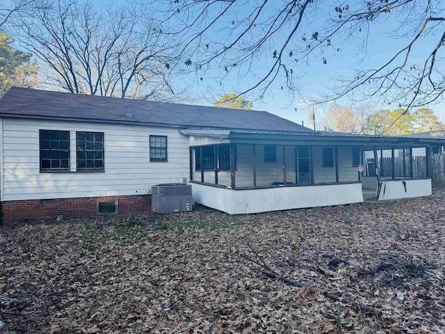 view of side of property with crawl space, a sunroom, and central AC unit