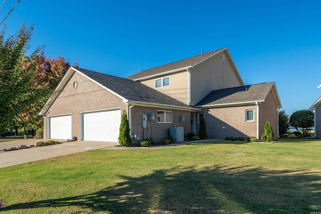 traditional-style house with central air condition unit, a garage, brick siding, concrete driveway, and a front yard