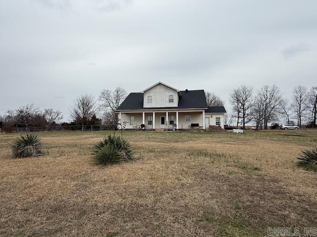 view of front of property with a front lawn and a porch