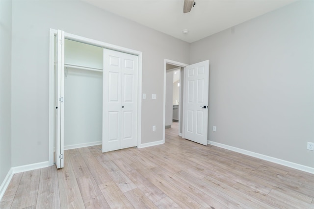 unfurnished bedroom with light wood-style floors, a closet, ceiling fan, and baseboards