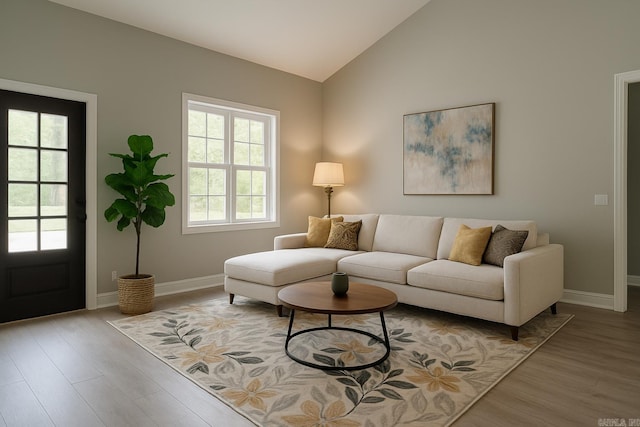 2 Tolosa Way, Hot Springs Village, AR 71909 - living room featuring vaulted ceiling, wood finished floors, and baseboards