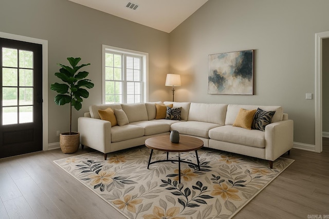 2 Tolosa Way, Hot Springs Village, AR 71909 - living room featuring plenty of natural light, wood finished floors, baseboards, and high vaulted ceiling