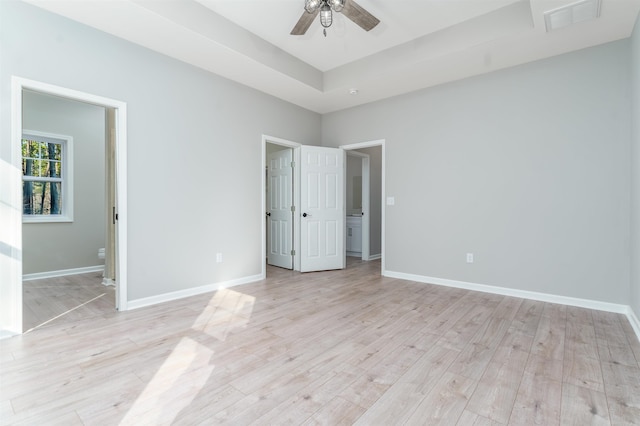 unfurnished bedroom with light wood-style flooring and baseboards