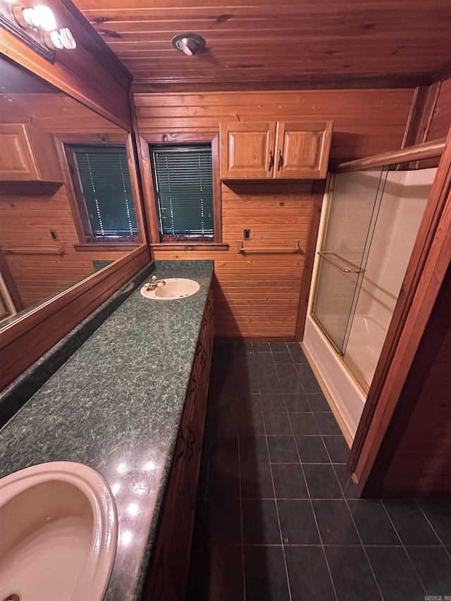 full bath with wood ceiling, enclosed tub / shower combo, wooden walls, vanity, and tile patterned floors