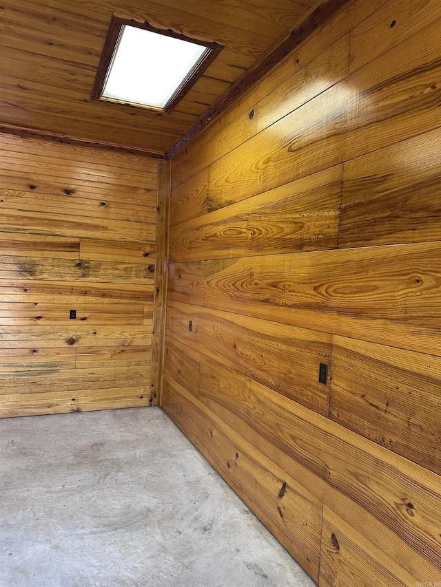 unfurnished room featuring carpet floors, wood walls, and wood ceiling