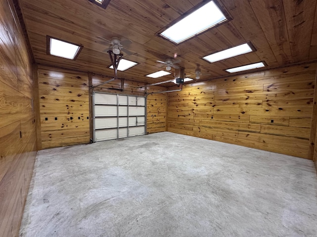 garage with wood ceiling and wooden walls