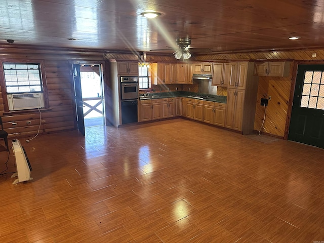 kitchen featuring gas cooktop, cooling unit, oven, a sink, and dark countertops