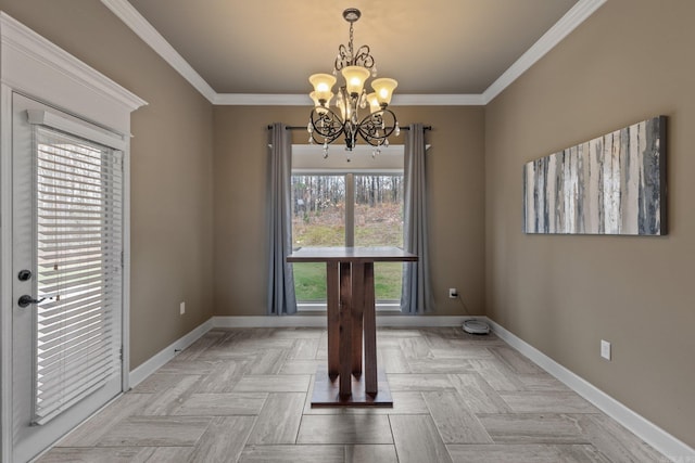 unfurnished dining area with ornamental molding, a notable chandelier, and baseboards