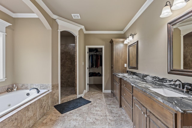 full bath with ornamental molding, double vanity, a tub with jets, and a sink