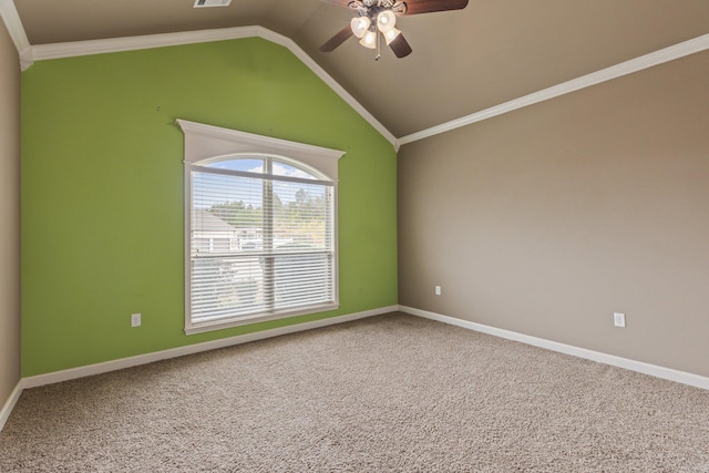 unfurnished room featuring lofted ceiling, a ceiling fan, baseboards, ornamental molding, and carpet