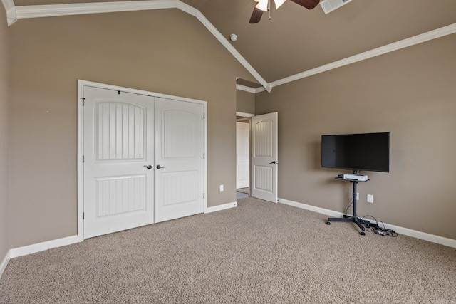 unfurnished bedroom featuring baseboards, ornamental molding, and carpet flooring