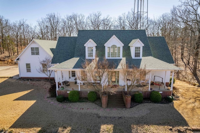 view of front of house with roof with shingles