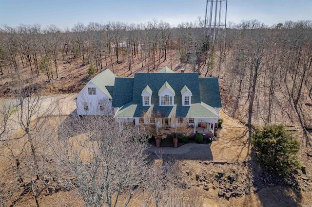 birds eye view of property with a forest view