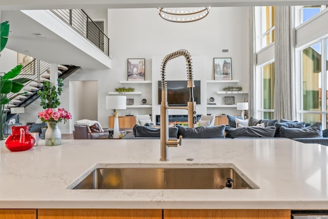 108 Mornay Ln, Little Rock, AR 72223 - kitchen featuring a towering ceiling, open floor plan, and a sink