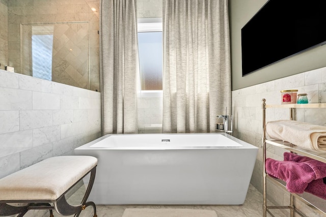 108 Mornay Ln, Little Rock, AR 72223 - bathroom featuring a freestanding tub and tile walls