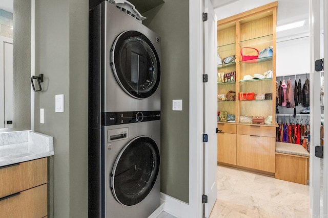 108 Mornay Ln, Little Rock, AR 72223 - washroom featuring stacked washer / drying machine, laundry area, and marble finish floor
