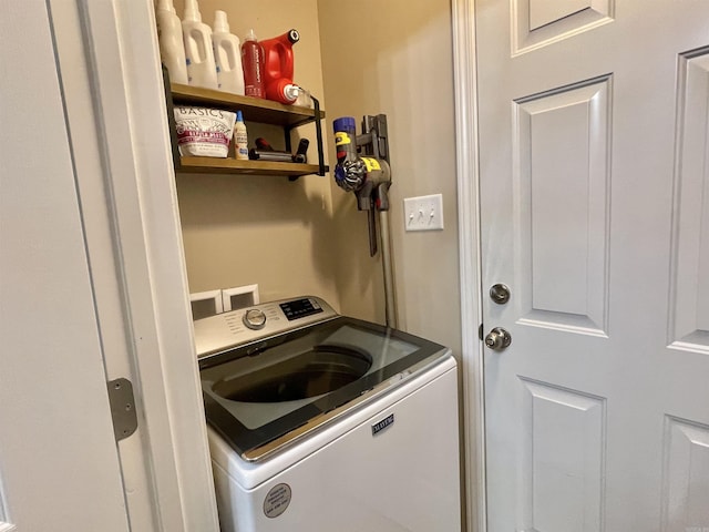 clothes washing area with laundry area and washer / clothes dryer