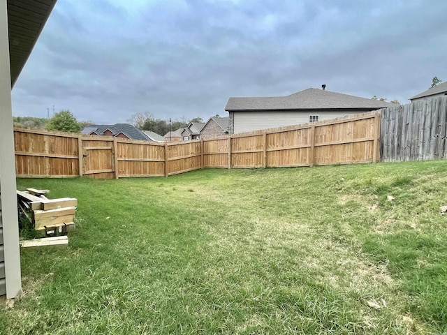 view of yard with a fenced backyard