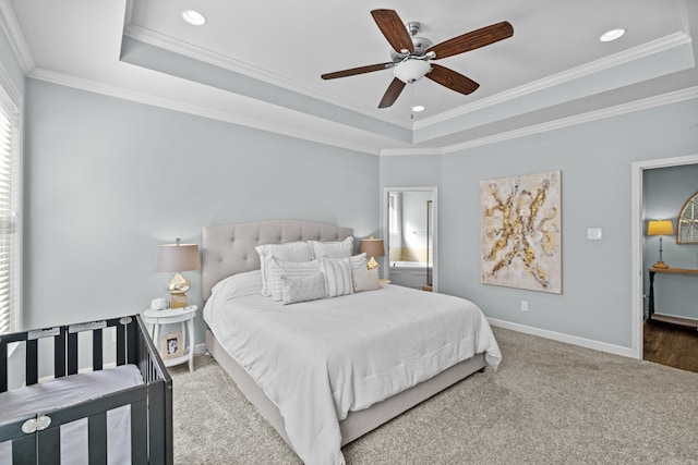 bedroom with baseboards, a raised ceiling, ornamental molding, carpet flooring, and recessed lighting