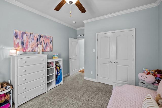 bedroom featuring carpet, crown molding, a closet, ceiling fan, and baseboards