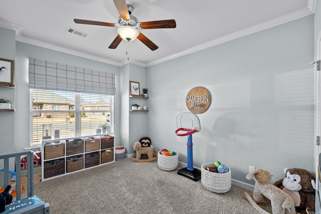 game room with visible vents, crown molding, carpet flooring, and ceiling fan