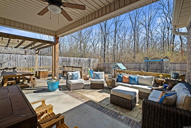 view of patio / terrace featuring a fenced backyard, outdoor lounge area, and a ceiling fan