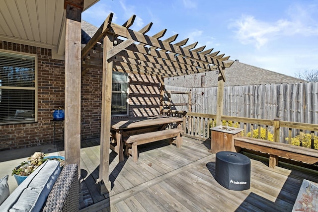 wooden terrace with fence and a pergola