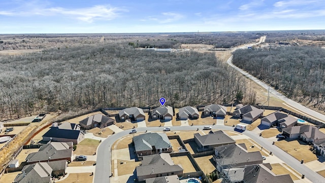 bird's eye view with a forest view and a residential view