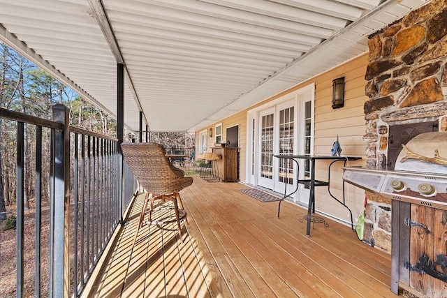 wooden deck featuring french doors