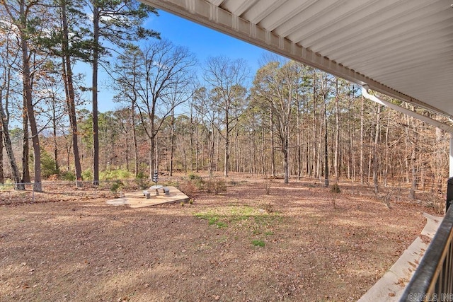 view of yard featuring a view of trees