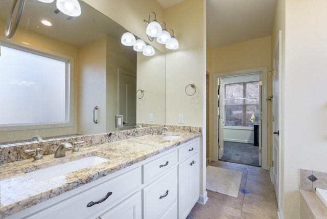 full bathroom with double vanity, visible vents, a sink, and tile patterned floors