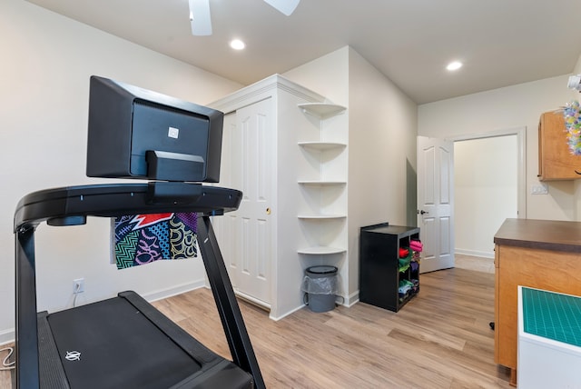 exercise room with light wood-type flooring, baseboards, and recessed lighting