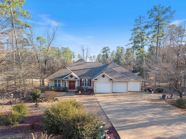 view of front facade with a garage and concrete driveway