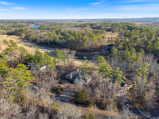 drone / aerial view with a view of trees