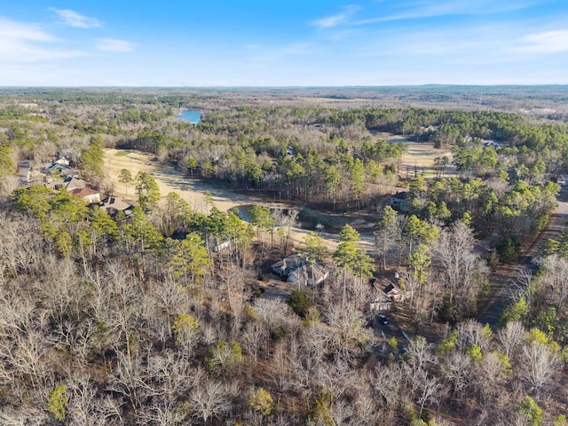 drone / aerial view featuring a forest view