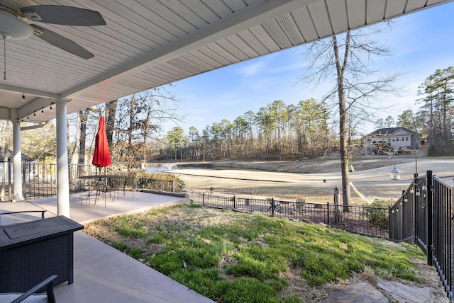 view of yard featuring ceiling fan, a patio, and fence