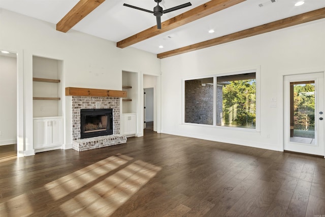 unfurnished living room featuring dark wood-style floors, a fireplace, ceiling fan, and baseboards