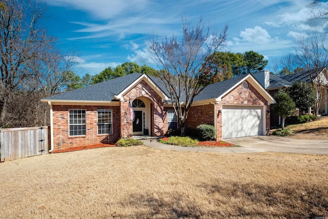 ranch-style home featuring a garage, concrete driveway, brick siding, and fence