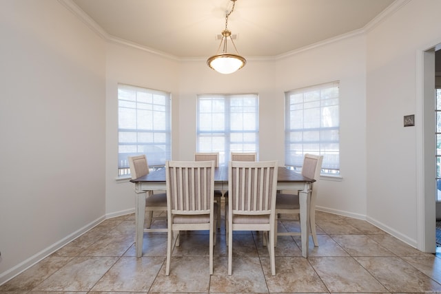 dining area with ornamental molding, baseboards, and light tile patterned floors