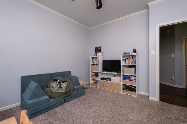 sitting room with carpet, baseboards, and crown molding