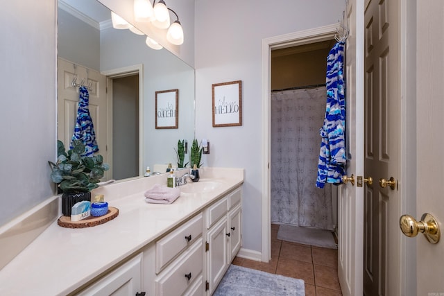 bathroom featuring tile patterned flooring and vanity