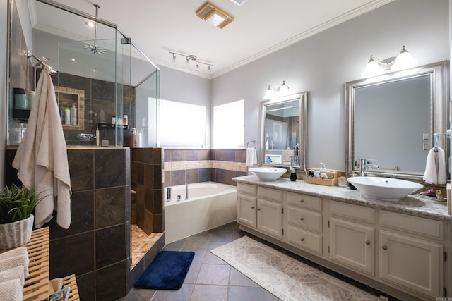 full bath featuring a stall shower, ornamental molding, and a sink