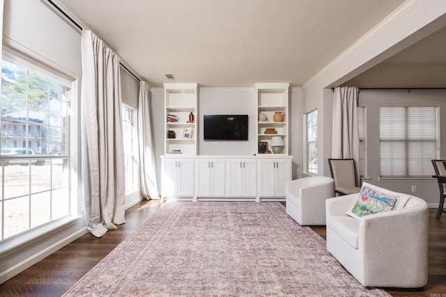 living room with dark wood-style floors, visible vents, and crown molding