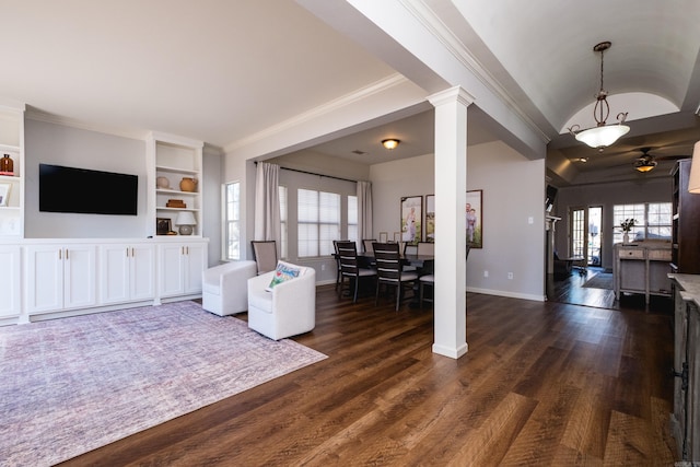 living area featuring dark wood-style floors, decorative columns, baseboards, and built in features